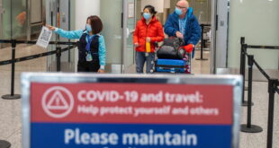 Travellers from an international flight are directed to the COVID-19 testing area as part of Canada's new measures against the…